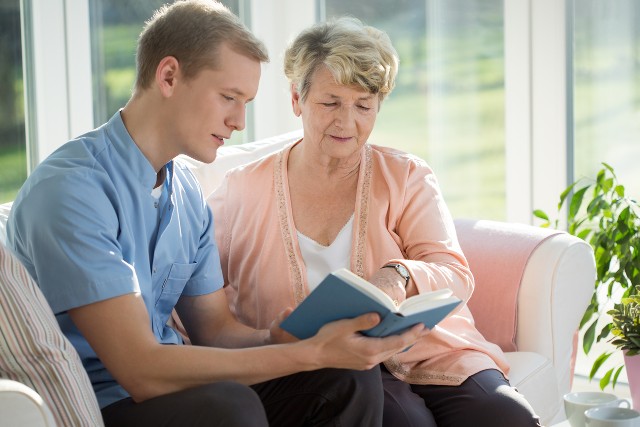Senior woman and caregiver talking together.